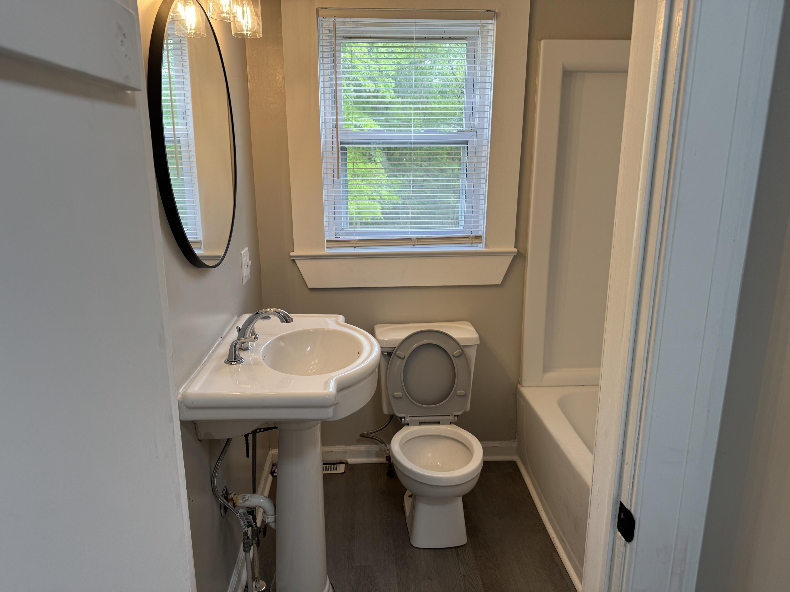 136 Nelson Avenue Danville, VA 24540 - Photo 7 of 7 a bathroom with a toilet sink and mirror