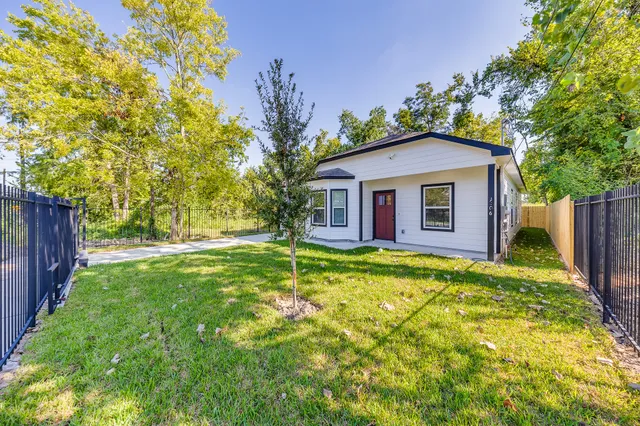 a front view of house with yard and green space