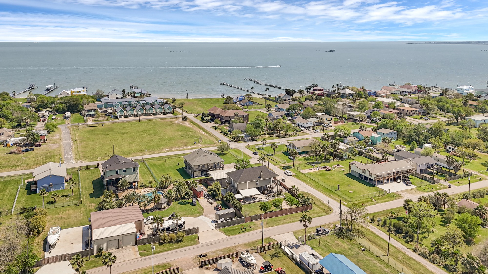 939 8th Street Dickinson, TX 77539 - Photo 18 of 31 This aerial photo showcases coastal San Leon with spacious homes, lush greenery, and easy access to the waterfront. Ideal for those seeking a serene, scenic setting near the bay.