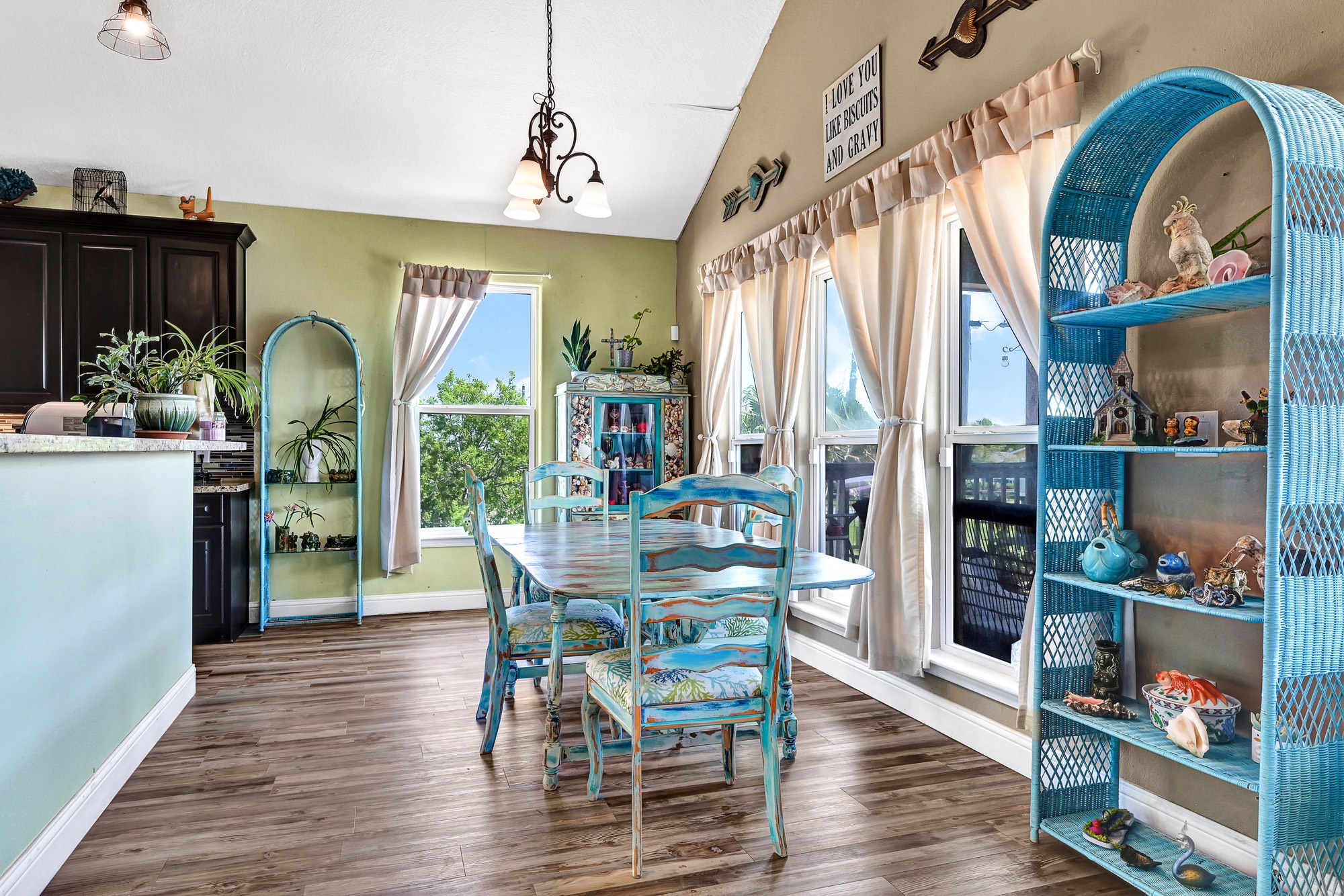 939 8th Street Dickinson, TX 77539 - Photo 22 of 31 Bright and inviting dining area with large windows, abundant natural light ideal for cozy, family gatherings.