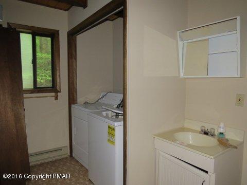 230 Selig Road Pocono Lake, PA 18347 - Photo 13 of 20 a bathroom with a sink and a vanity