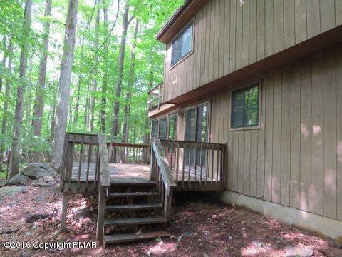 230 Selig Road Pocono Lake, PA 18347 - Photo 4 of 20 a front view of a house with a garden