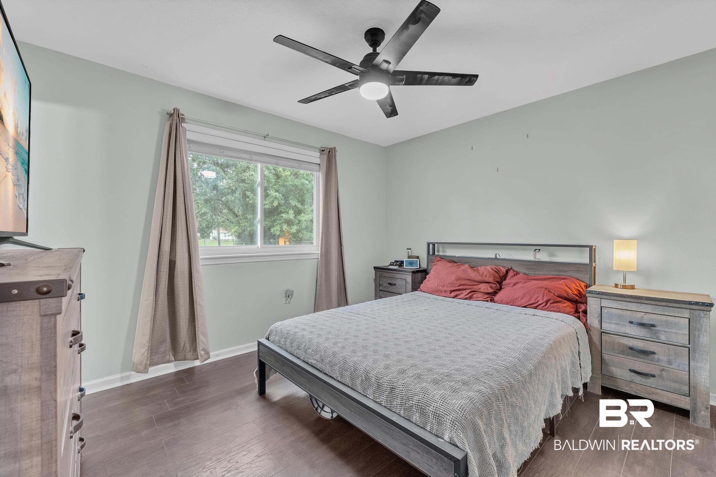 206 West Jackson Avenue Summerdale, AL 36580 - Photo 20 of 37 Bedroom with wood finished floors, baseboards, and ceiling fan