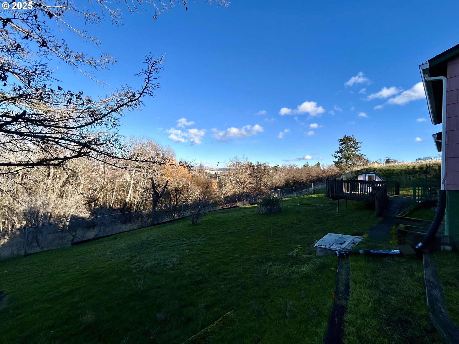 823 West 8th Street The Dalles, OR 97058 - Photo 4 of 20 a view of a golf course with a lake