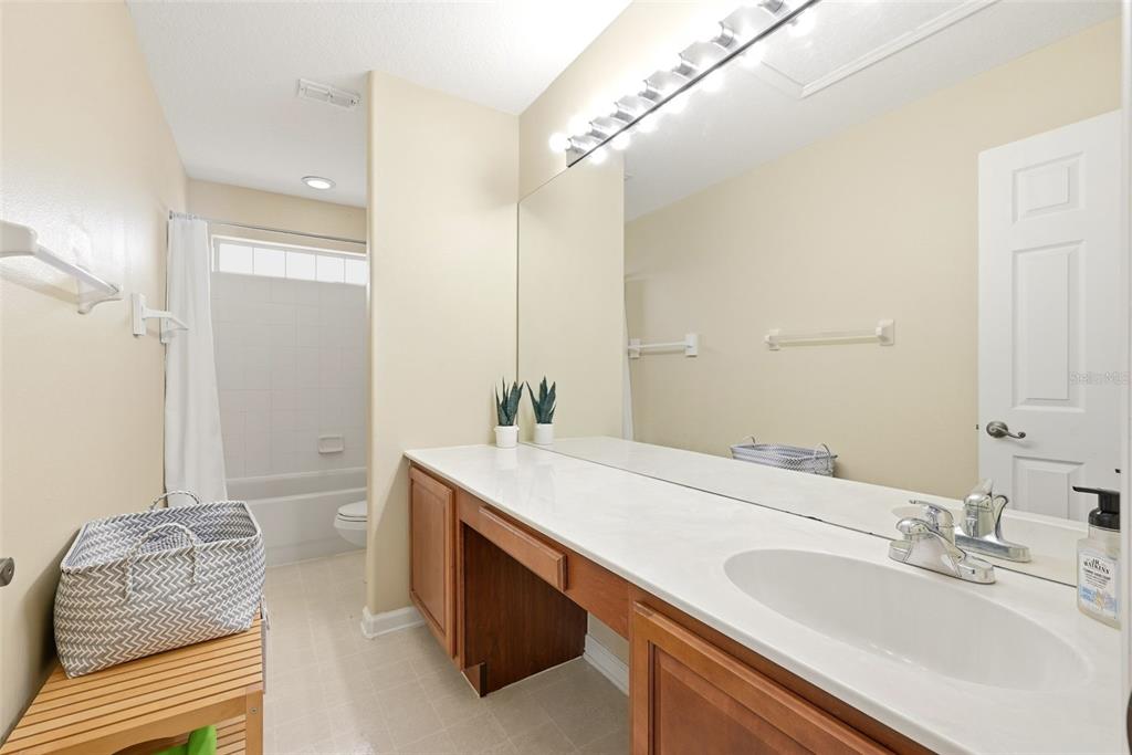 936 Kingsridge Circle Gotha, FL 34734 - Photo 24 of 50 a bathroom with a sink and a mirror