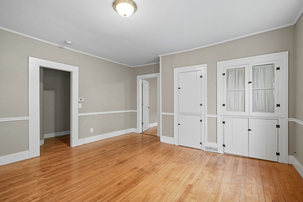 941 Allen Street Springfield, MA 01118 - Photo 7 of 28 a view of an empty room with wooden floor