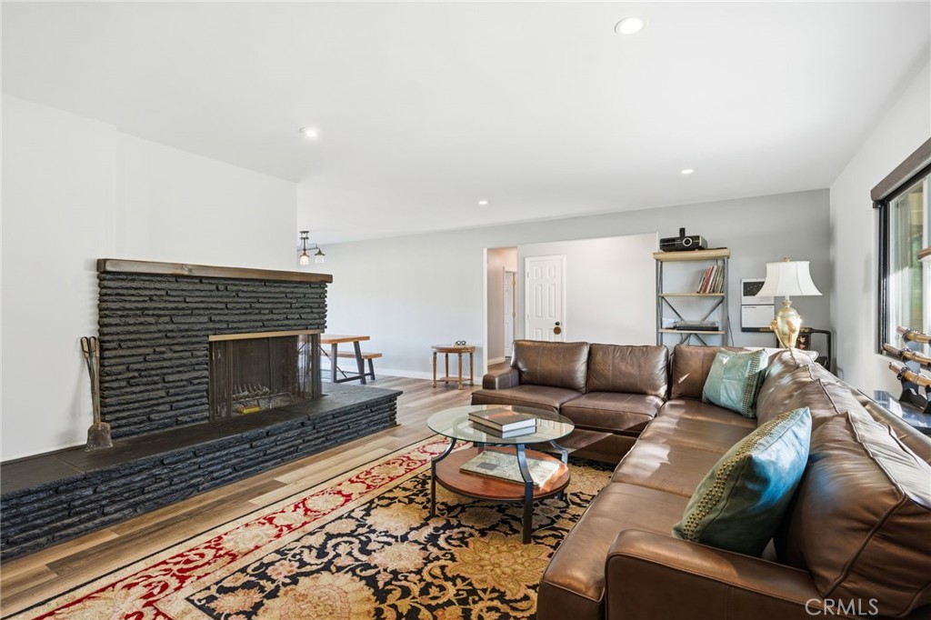 14010 Hilldale Road Valley Center, CA 92082 - Photo 12 of 28 a living room with furniture a rug and a fireplace