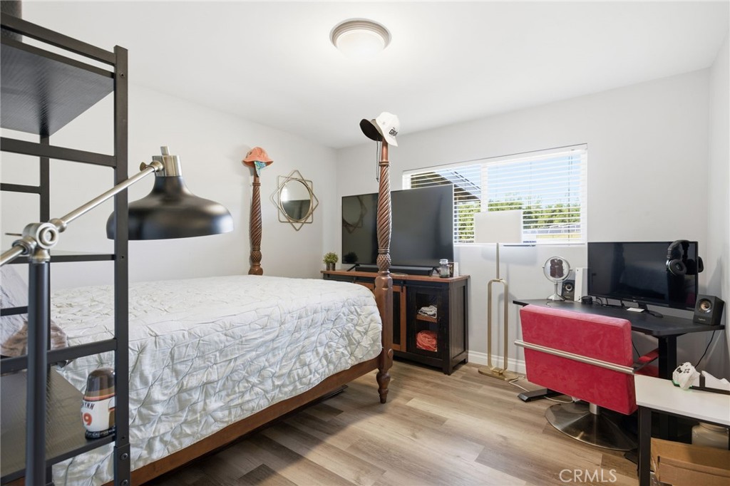14010 Hilldale Road Valley Center, CA 92082 - Photo 15 of 28 a bedroom with a bed and a flat screen tv