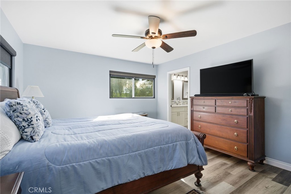 14010 Hilldale Road Valley Center, CA 92082 - Photo 18 of 28 a bedroom with a bed and a flat screen tv
