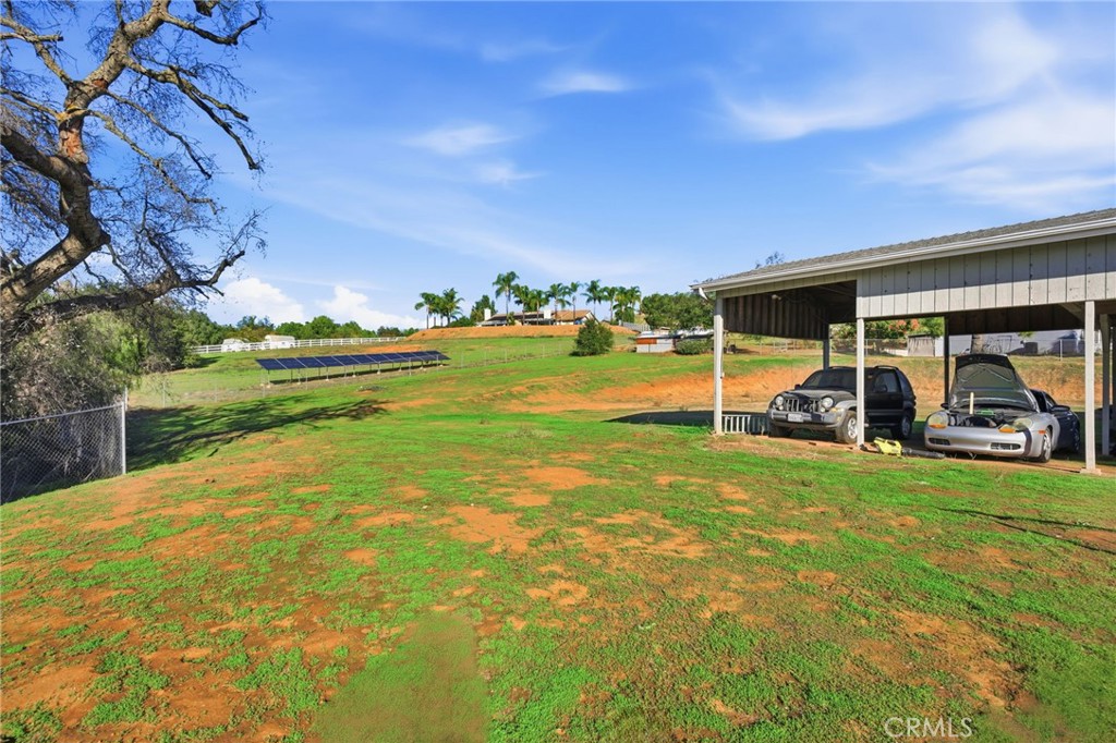14010 Hilldale Road Valley Center, CA 92082 - Photo 25 of 28 a view of a patio with table and chairs under an umbrella