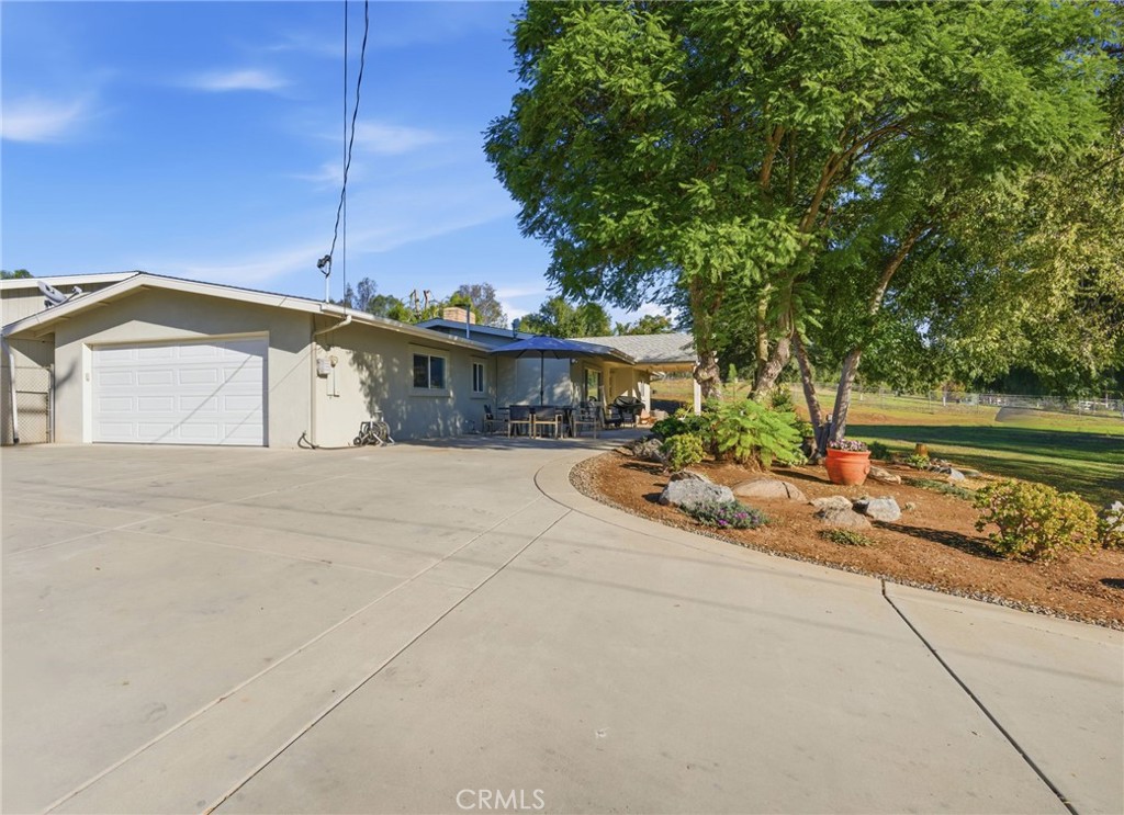 14010 Hilldale Road Valley Center, CA 92082 - Photo 26 of 28 a view of a house with a yard and sitting area