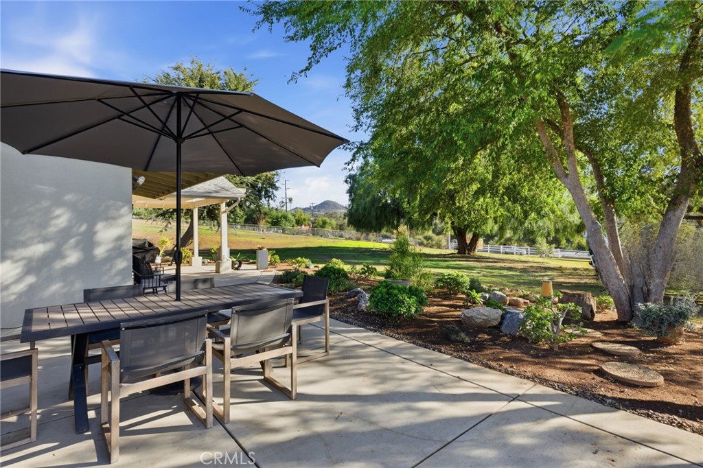 14010 Hilldale Road Valley Center, CA 92082 - Photo 27 of 28 a view of a table and chairs under an umbrella
