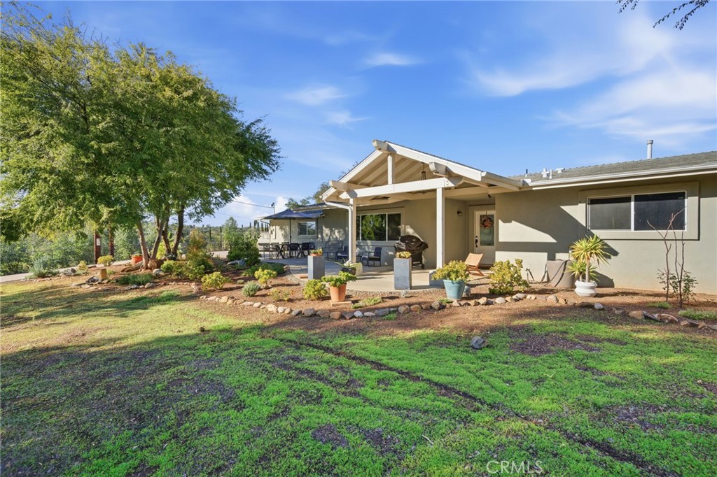 14010 Hilldale Road Valley Center, CA 92082 - Photo 28 of 28 a view of a house with backyard porch and sitting area