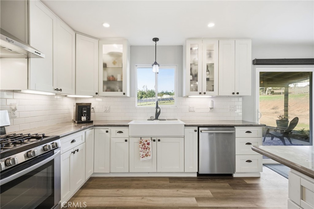 14010 Hilldale Road Valley Center, CA 92082 - Photo 8 of 28 a kitchen with stainless steel appliances white cabinets and a sink