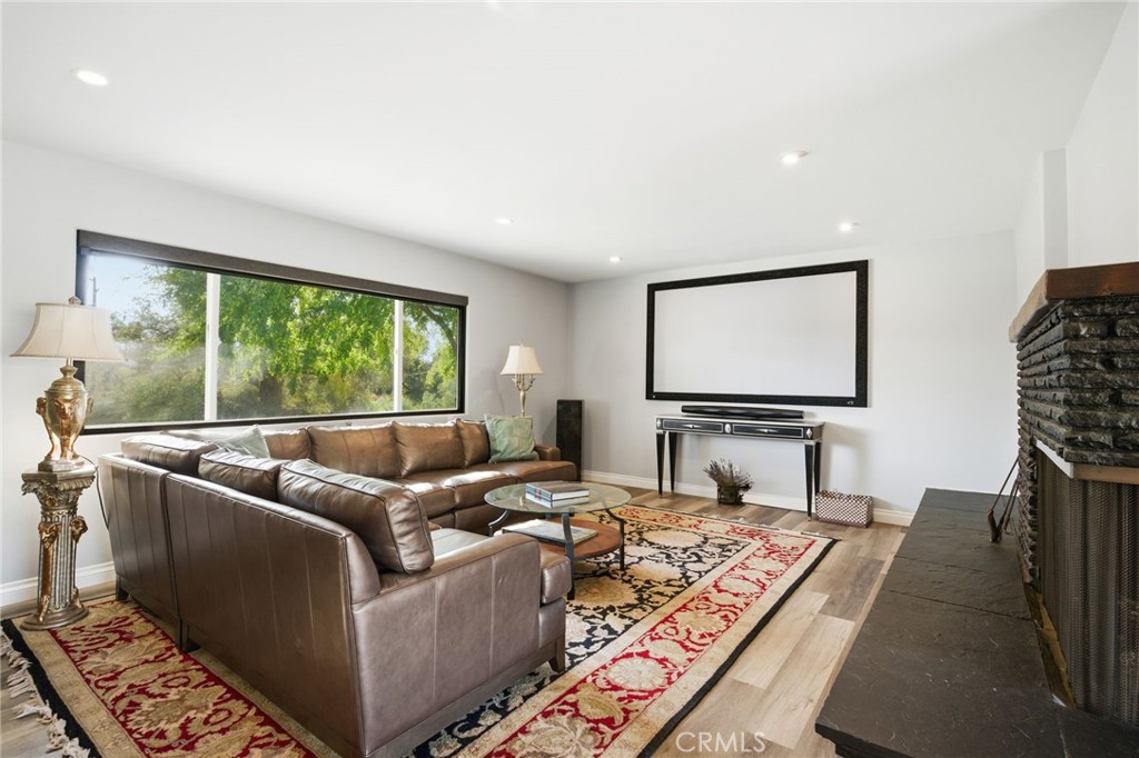 14010 Hilldale Road Valley Center, CA 92082 - Photo 10 of 28 a living room with furniture and a flat screen tv
