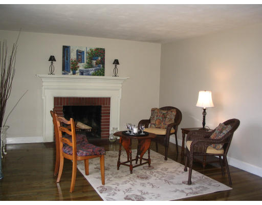107 Newton Road Springfield, MA 01118 - Photo 11 of 17 a dining room with furniture and a fireplace