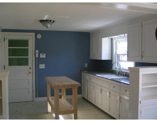 107 Newton Road Springfield, MA 01118 - Photo 5 of 17 a kitchen with a sink and cabinets