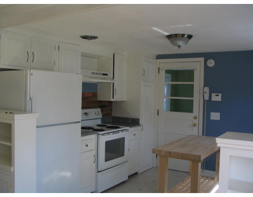 107 Newton Road Springfield, MA 01118 - Photo 6 of 17 a kitchen with cabinets and appliances