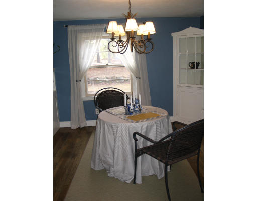 107 Newton Road Springfield, MA 01118 - Photo 8 of 17 a view of a dining room with a chandelier furniture and a chandelier