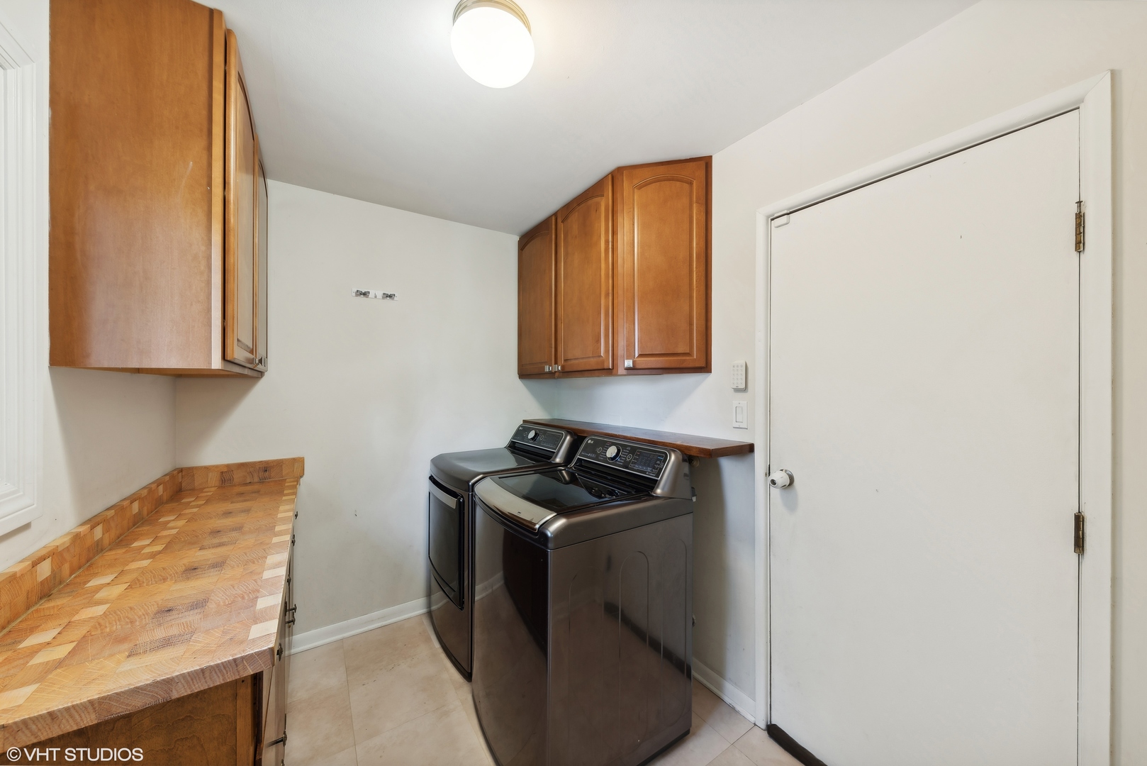 521 North Rohlwing Road Palatine, IL 60074 - Photo 16 of 19 a kitchen with stainless steel appliances granite countertop white cabinets and a stove