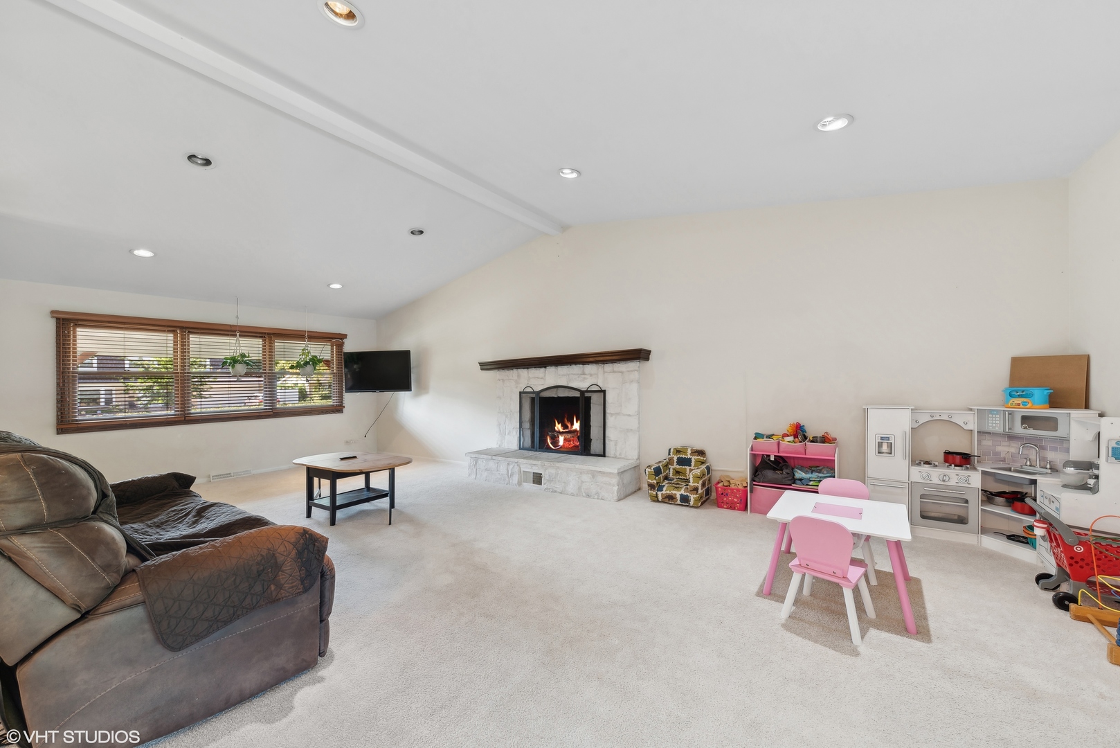 521 North Rohlwing Road Palatine, IL 60074 - Photo 2 of 19 a living room with furniture and a fireplace