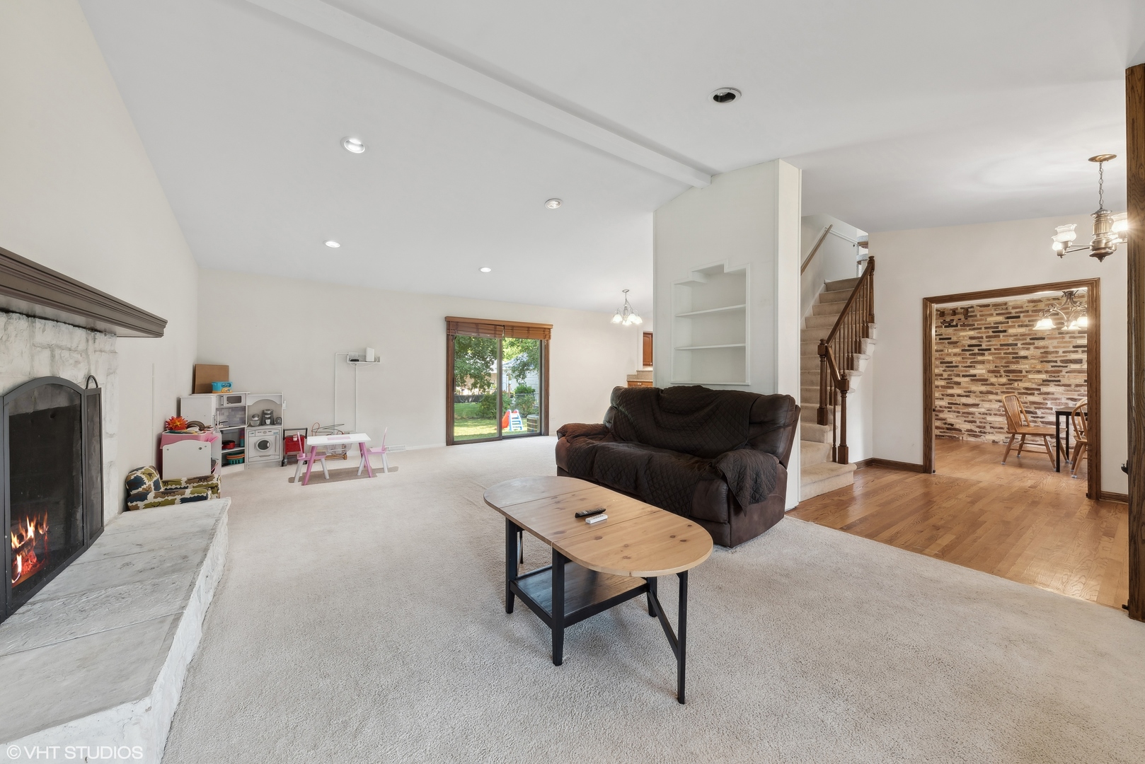 521 North Rohlwing Road Palatine, IL 60074 - Photo 3 of 19 a living room with furniture and a fireplace