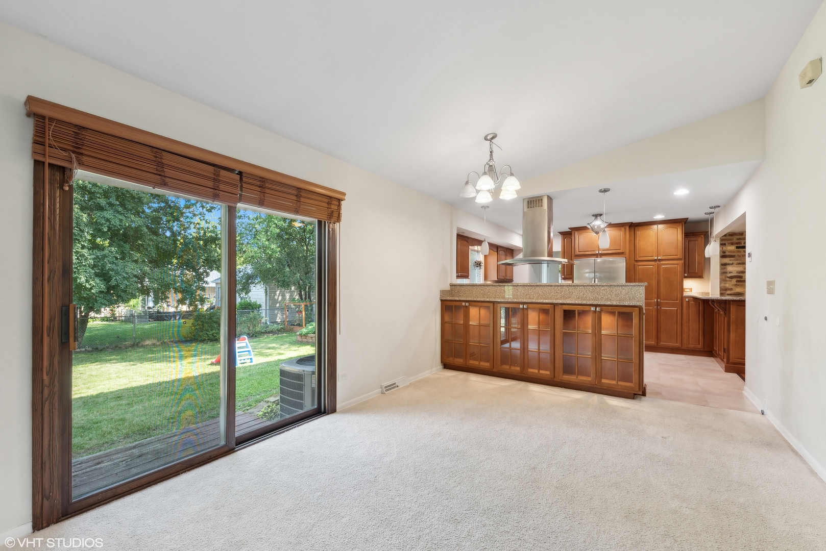 521 North Rohlwing Road Palatine, IL 60074 - Photo 9 of 19 a large room with kitchen view and a large window