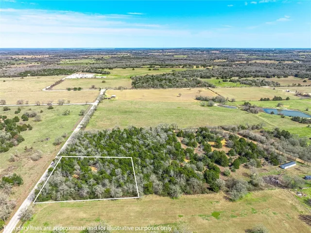 a view of a swimming pool with a yard