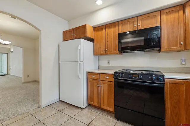 a kitchen with a stove and a microwave
