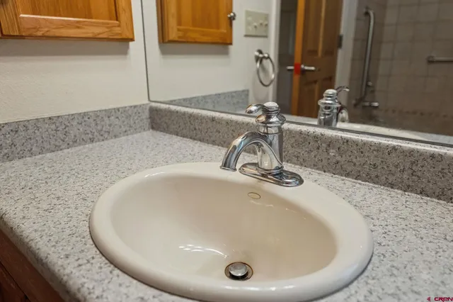 a bathroom with a sink and a mirror