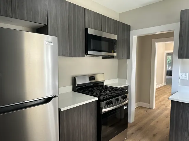 a kitchen with a stove and a microwave