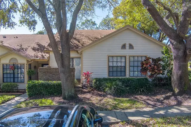 an aerial view of a houses with a yard