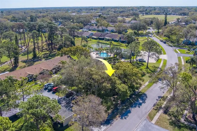 an aerial view of house with yard swimming pool and mountain view