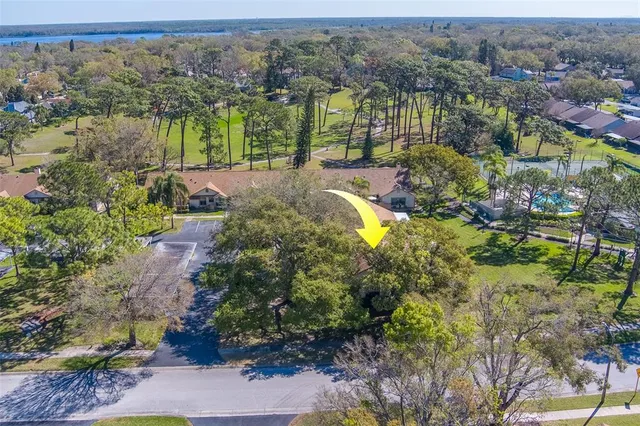 an aerial view of residential house with outdoor space and swimming pool