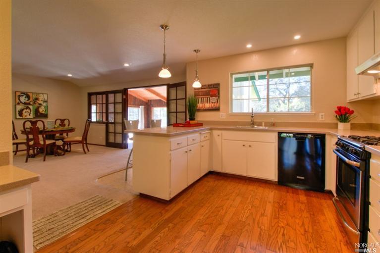1579 Schaeffer Road Sebastopol, CA 95472 - Photo 1 of 1 a kitchen with stainless steel appliances granite countertop a stove and cabinets