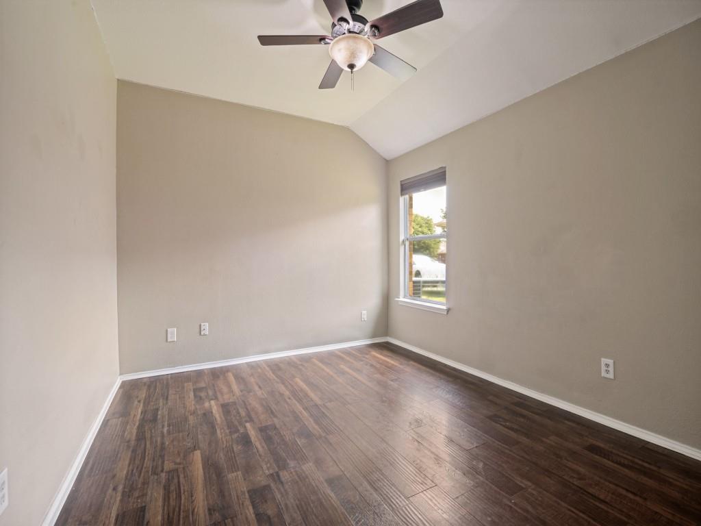 119 Robin Lane Forney, TX 75126 - Photo 23 of 27 Vaulted ceiling room featuring wood-finish flooring, a single window with blinds, and a ceiling fan with integrated lighting
