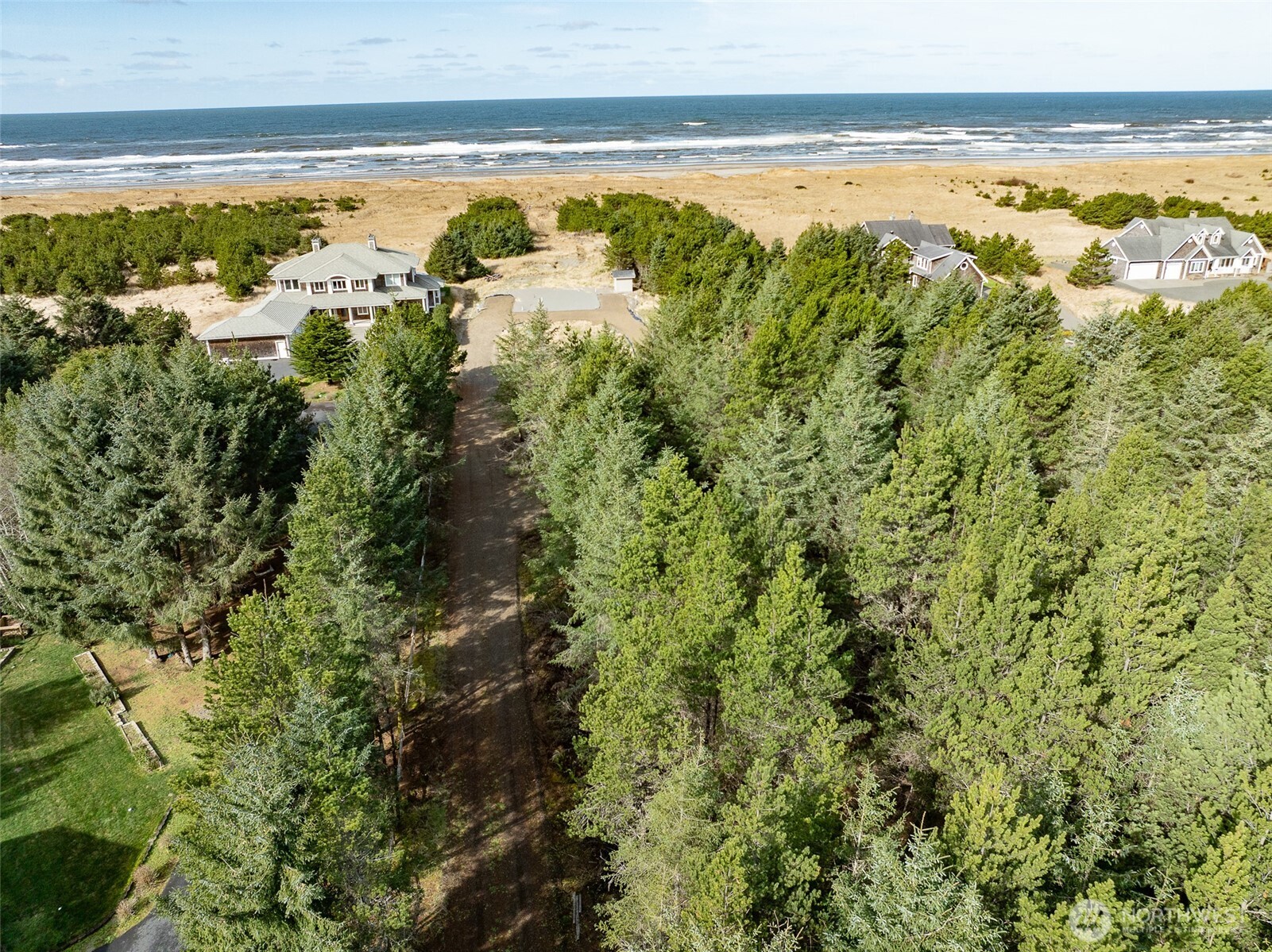 a view of a yard with an ocean view