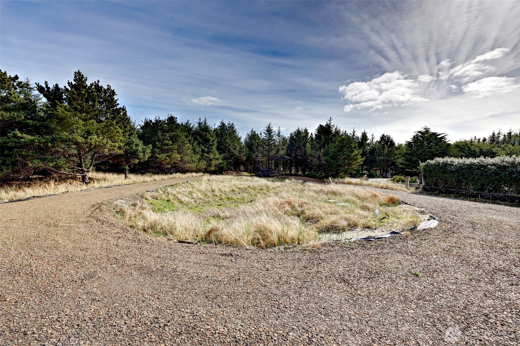 16151 Pacific Way Long Beach, WA 98631 - Photo 21 of 23 a view of a dry yard covered with snow in the background
