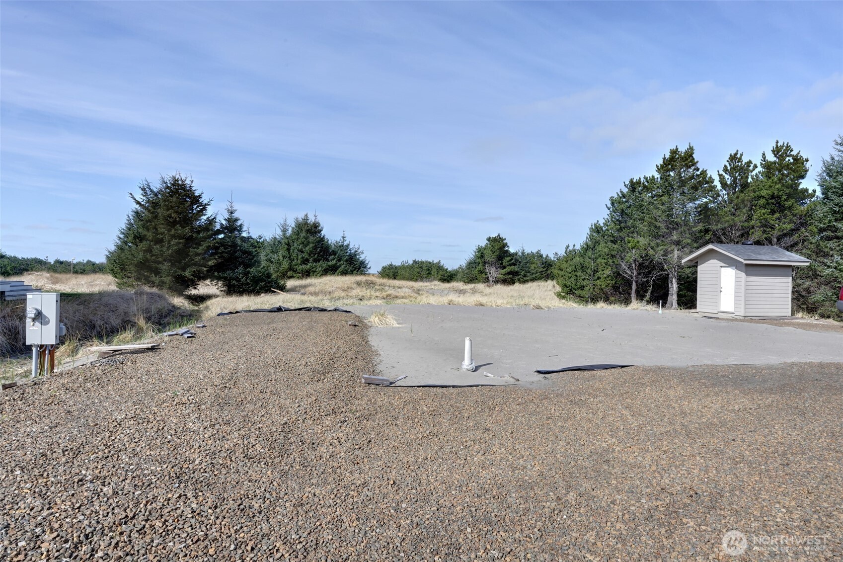 16151 Pacific Way Long Beach, WA 98631 - Photo 22 of 23 a view of a dirt road with a building in the background