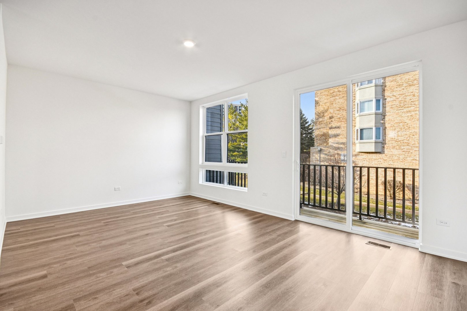 373 Summit Circle Lombard, IL 60148 - Photo 13 of 45 a view of a room with wooden floor and windows