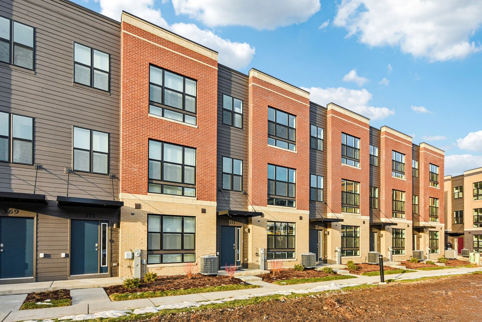 373 Summit Circle Lombard, IL 60148 - Photo 2 of 45 a front view of a building with a street