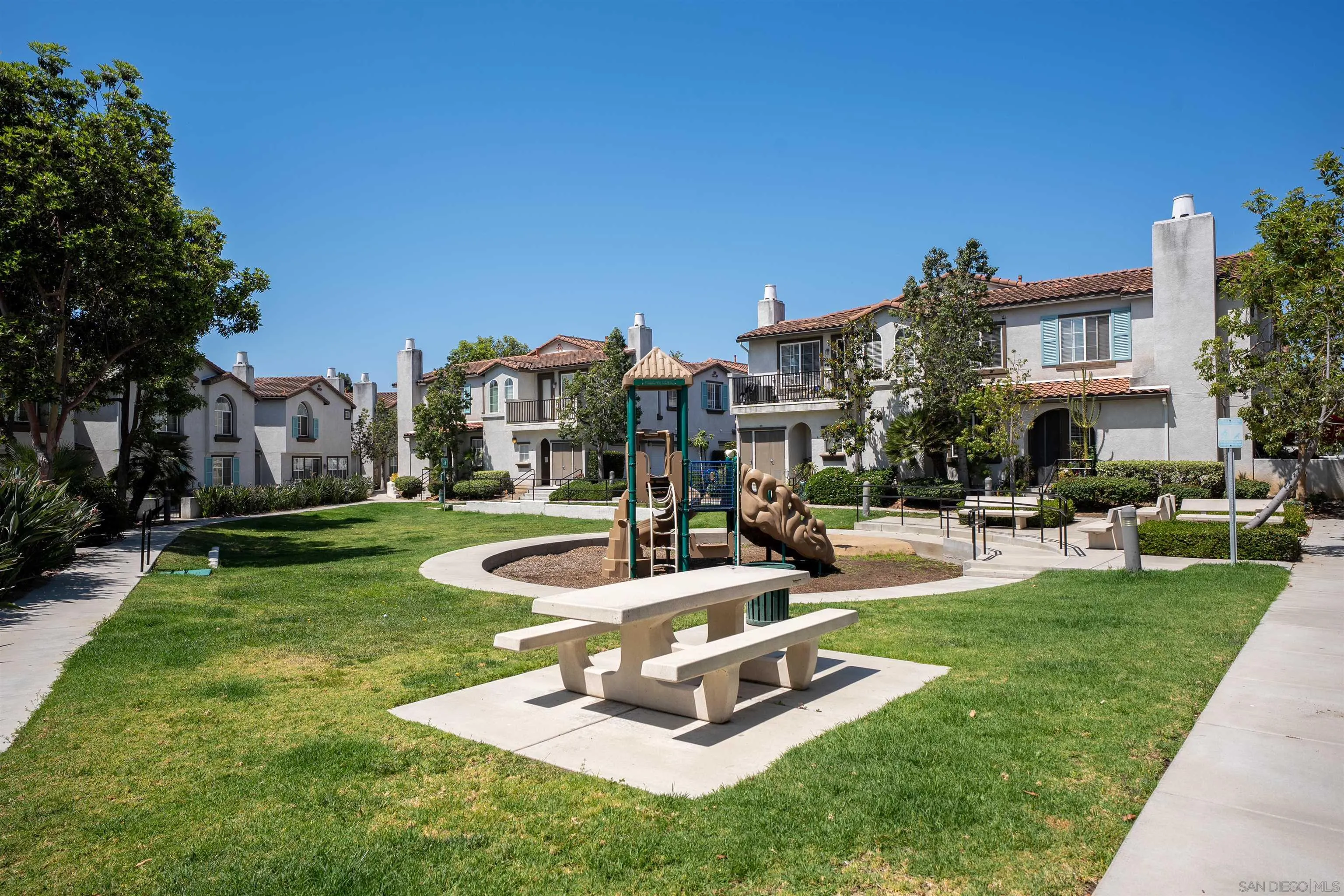 289 Reef Point Way, Unit 3 Oceanside, CA 92058 - Photo 23 of 23 a view of a house with swimming pool and chairs