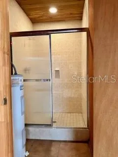 a bathroom with a glass shower door