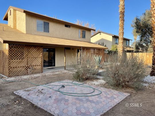 200 North American Street Ridgecrest, CA 93555 - Photo 9 of 23 a backyard of a house with yard fire pit and outdoor seating