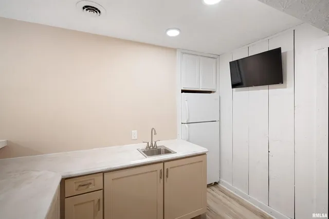 a bathroom with a sink and mirror