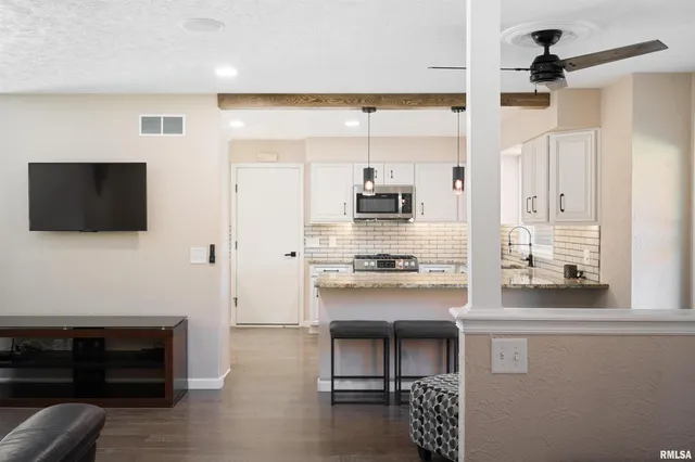 a kitchen with stainless steel appliances a stove and a refrigerator