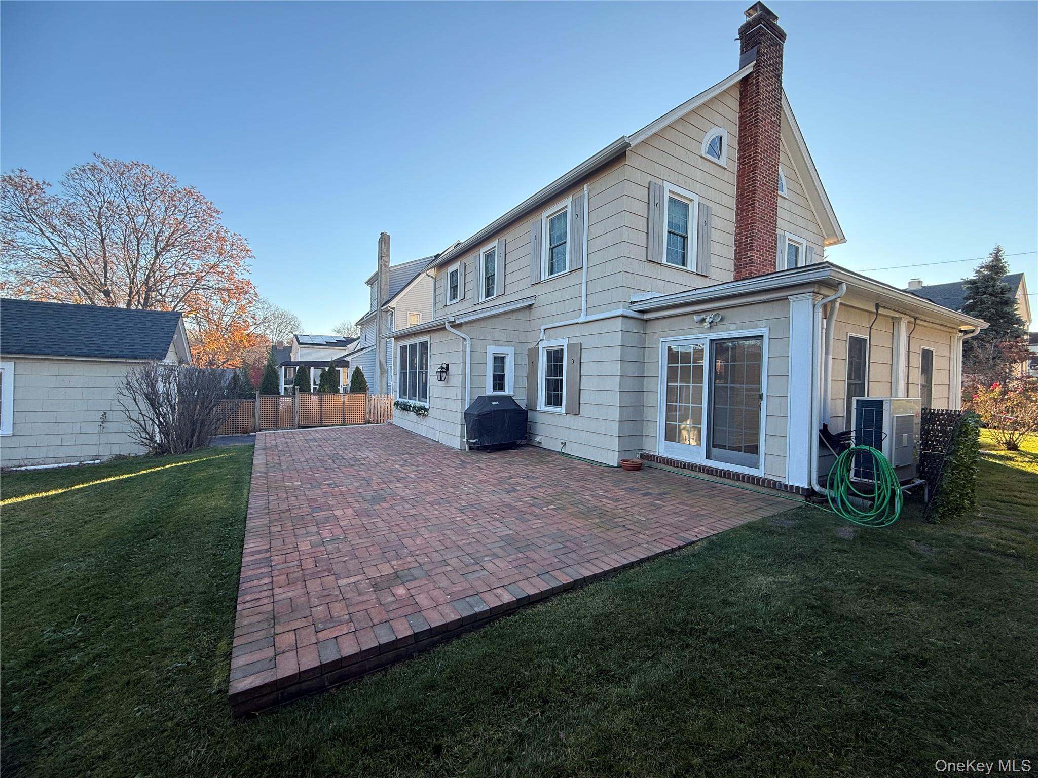 71 Hillcrest Avenue Manhasset, NY 11030 - Photo 22 of 23 a view of a house with a yard