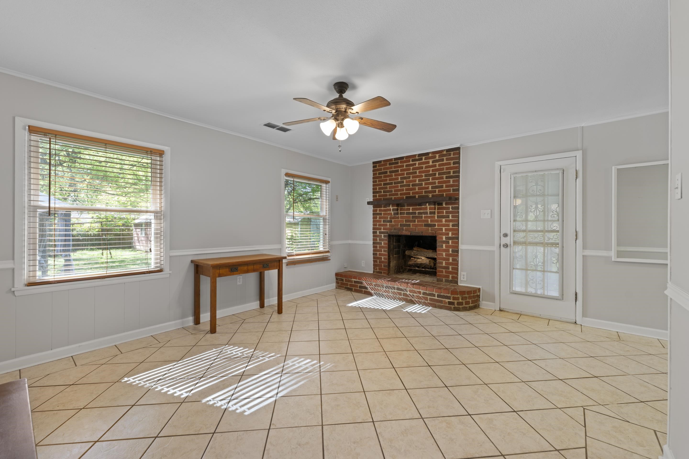 1603 Colonial Road Memphis, TN 38117 - Photo 1 of 24 a bedroom with furniture fireplace and a window