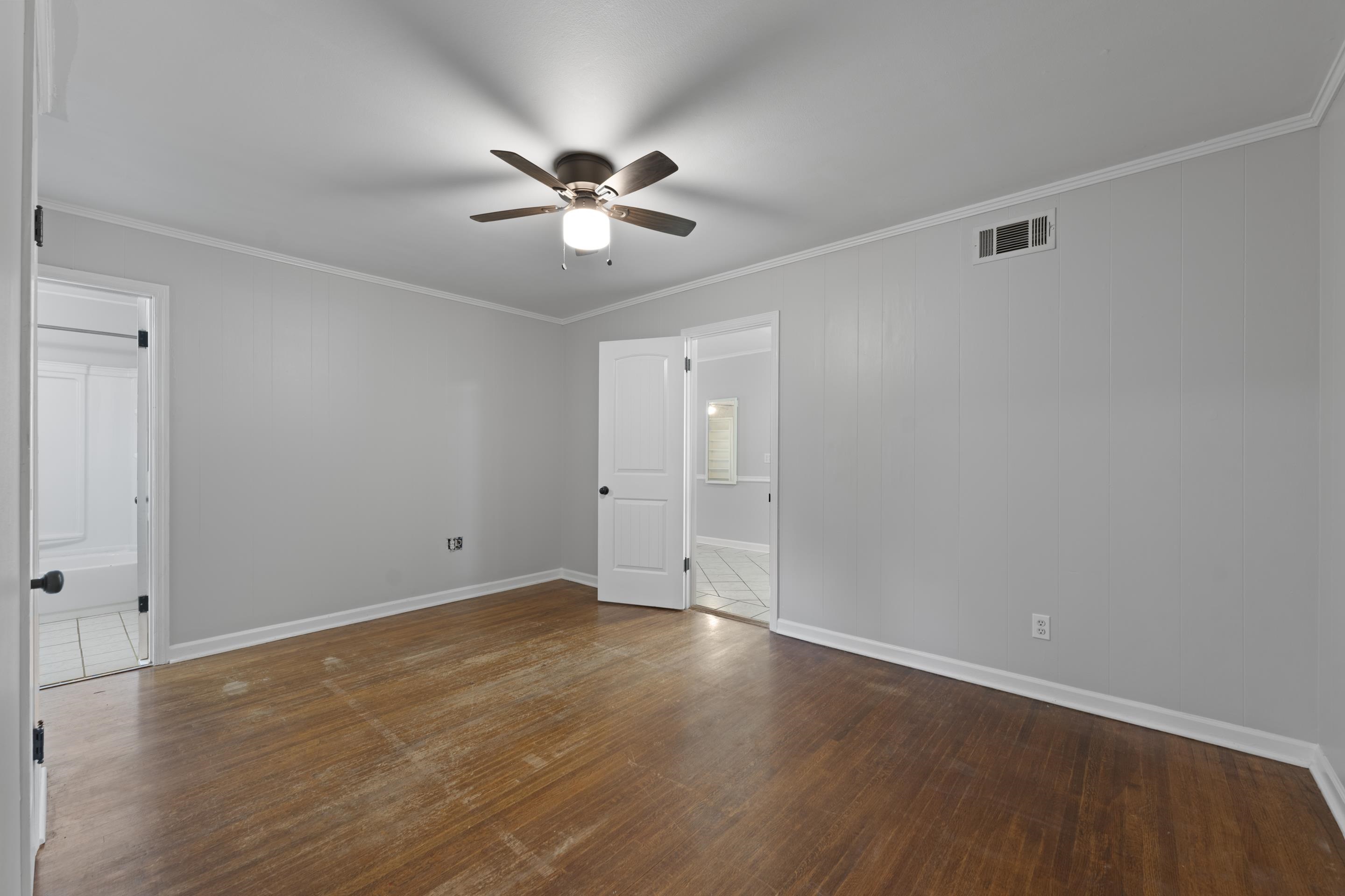 1603 Colonial Road Memphis, TN 38117 - Photo 11 of 24 a view of an empty room with wooden floor