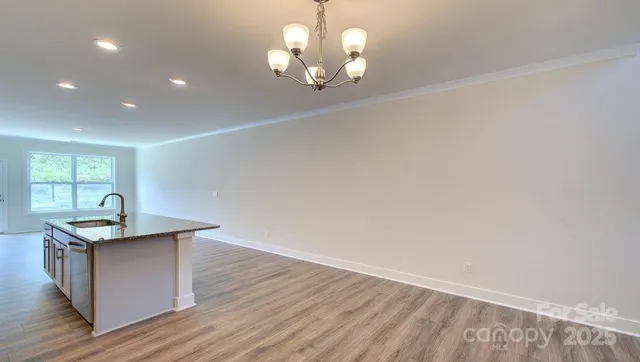 a room with wooden floor and window